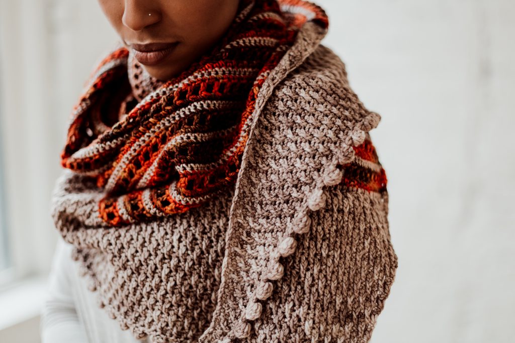 Try the Bronwyn Shawl, a FREE crochet triangle shawl pattern from TLYCBlog.com. Explore the range of crochet techniques and stitches in this asymmetrical triangle wrap. Elevate the experience by using luxurious yarns like merino wool and baby alpaca. Find the FREE crochet pattern on TLYCBlog.com with links to helpful tutorial videos. | TLYCBlog.com