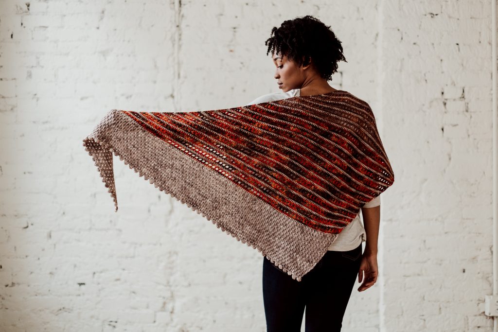 Try the Bronwyn Shawl, a FREE crochet triangle shawl pattern from TLYCBlog.com. Explore the range of crochet techniques and stitches in this asymmetrical triangle wrap. Elevate the experience by using luxurious yarns like merino wool and baby alpaca. Find the FREE crochet pattern on TLYCBlog.com with links to helpful tutorial videos. | TLYCBlog.com